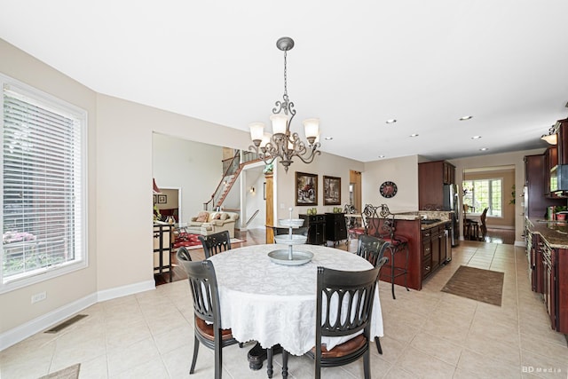 21359 Saddle Ln, Mokena, IL 60448 - dining area with a chandelier, light tile patterned floors, recessed lighting, baseboards, and stairs