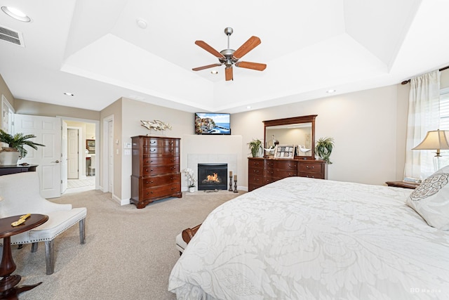 21359 Saddle Ln, Mokena, IL 60448 - carpeted bedroom with a raised ceiling, a fireplace, recessed lighting, a ceiling fan, and baseboards