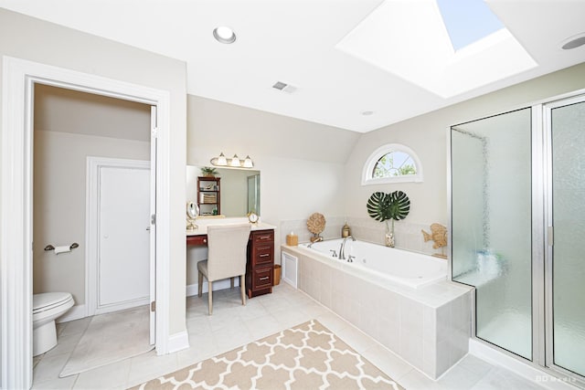 21359 Saddle Ln, Mokena, IL 60448 - full bath featuring a skylight, a bath, toilet, tile patterned floors, and a shower stall