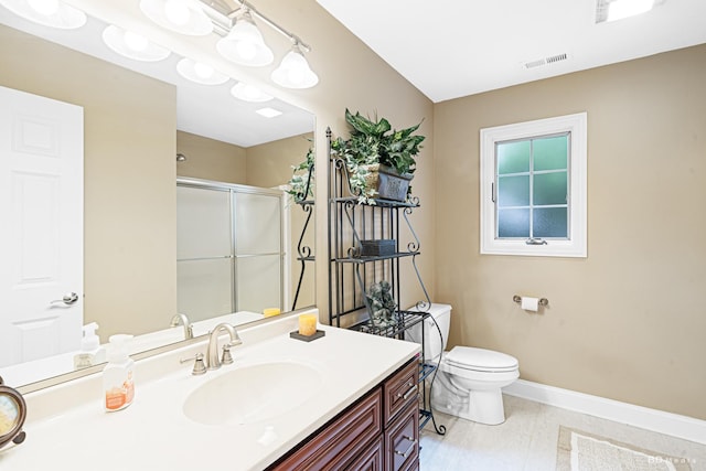 21359 Saddle Ln, Mokena, IL 60448 - full bath with baseboards, a shower stall, toilet, and vanity