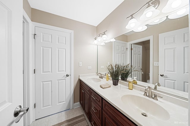 21359 Saddle Ln, Mokena, IL 60448 - full bath featuring toilet, double vanity, tile patterned flooring, and baseboards