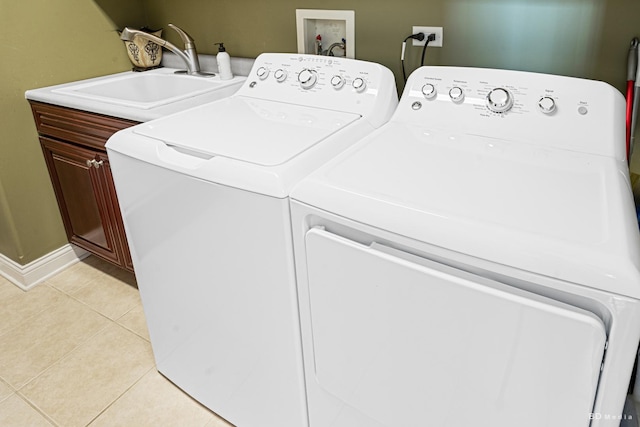 21359 Saddle Ln, Mokena, IL 60448 - clothes washing area with cabinet space, separate washer and dryer, light tile patterned flooring, and baseboards