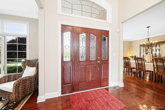21359 Saddle Ln, Mokena, IL 60448 - entryway with dark wood-type flooring, healthy amount of natural light, a chandelier, baseboards, and ornamental molding