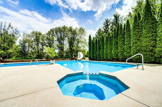 21359 Saddle Ln, Mokena, IL 60448 - view of swimming pool with a water slide, a pool with connected hot tub, and a patio area