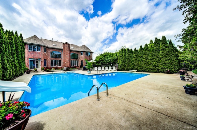 21359 Saddle Ln, Mokena, IL 60448 - outdoor pool featuring a water slide, a patio, and a diving board