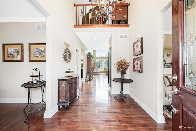 21359 Saddle Ln, Mokena, IL 60448 - foyer entrance with dark wood-style flooring, a chandelier, and baseboards