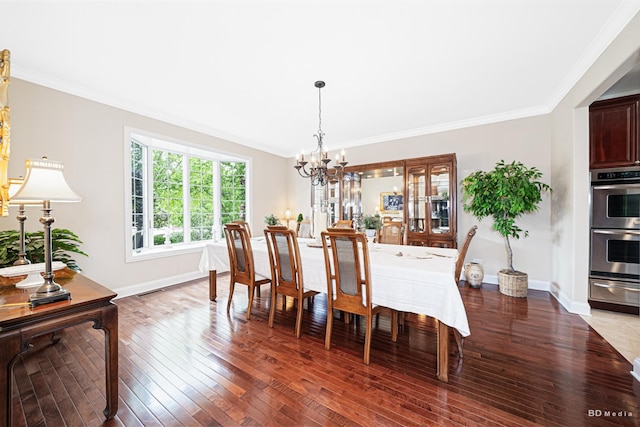 21359 Saddle Ln, Mokena, IL 60448 - dining space with a chandelier, hardwood / wood-style flooring, baseboards, and crown molding