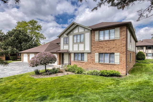 13206 N Country Club Ct Unit 1A, Palos Heights, IL 60463 - english style home with brick siding, a front yard, driveway, and an attached garage