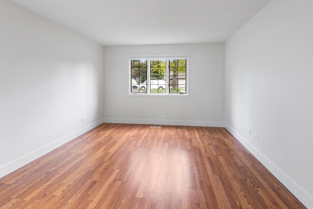 13206 N Country Club Ct Unit 1A, Palos Heights, IL 60463 - spare room featuring wood finished floors and baseboards