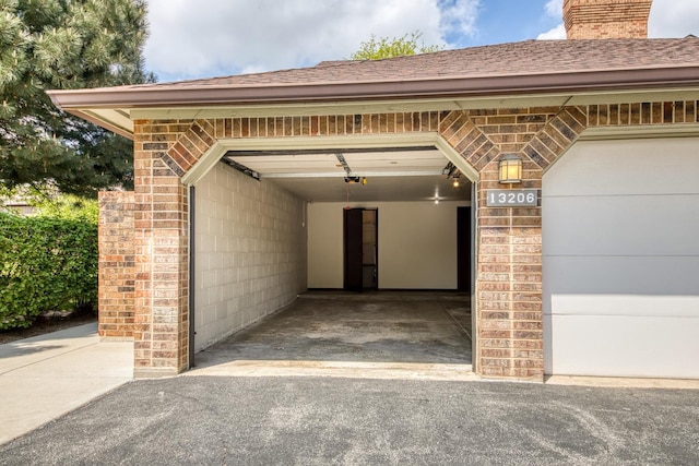 13206 N Country Club Ct Unit 1A, Palos Heights, IL 60463 - garage featuring a garage door opener and asphalt driveway