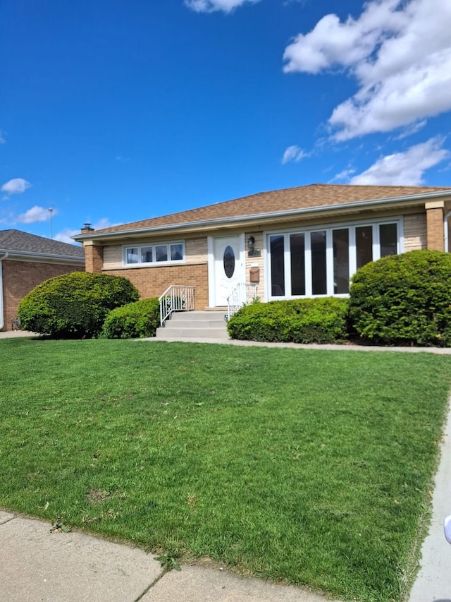 4607 Kolze Ave, Schiller Park, IL 60176 - view of front of home featuring a front lawn and brick siding