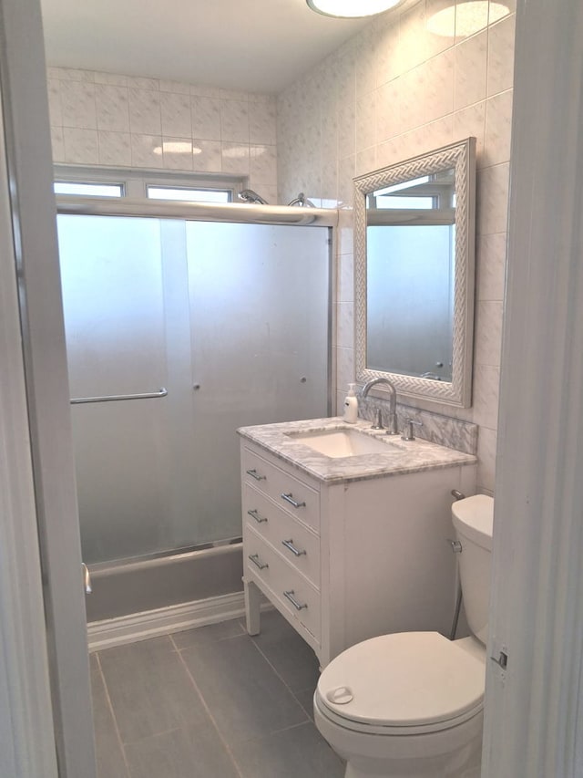 4607 Kolze Ave, Schiller Park, IL 60176 - full bath featuring plenty of natural light, tile patterned floors, toilet, and a shower with shower door