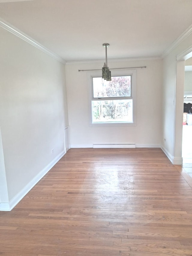 4607 Kolze Ave, Schiller Park, IL 60176 - unfurnished dining area with a baseboard radiator, wood finished floors, crown molding, baseboards, and a chandelier