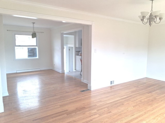 4607 Kolze Ave, Schiller Park, IL 60176 - spare room featuring a baseboard heating unit, wood finished floors, a chandelier, crown molding, and baseboards