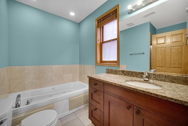 bathroom with toilet, a bath, marble look tiles, and vanity
