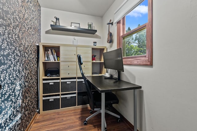 525 W Jackson St, Woodstock, IL 60098 - home office featuring wallpapered walls, wood finished floors, and baseboards
