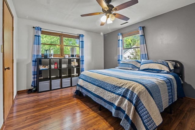 525 W Jackson St, Woodstock, IL 60098 - bedroom with wood-type flooring, ceiling fan, and baseboards