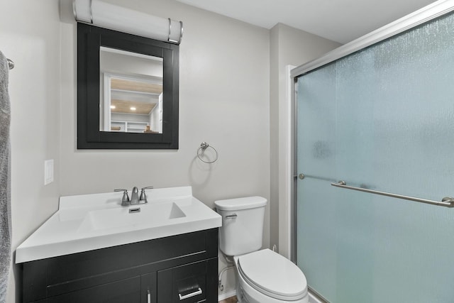 525 W Jackson St, Woodstock, IL 60098 - bathroom featuring vanity, a stall shower, and toilet