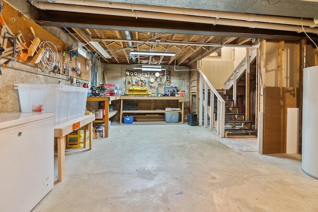 525 W Jackson St, Woodstock, IL 60098 - unfinished below grade area featuring a workshop area, water heater, and stairway