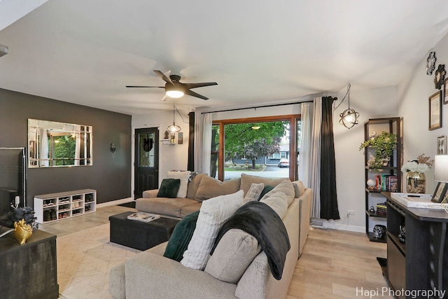 2007 Oak Dr, Mchenry, IL 60050 - living area featuring ceiling fan, baseboards, and light wood-style floors