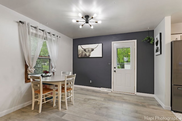 2007 Oak Dr, Mchenry, IL 60050 - dining area featuring a chandelier, healthy amount of natural light, and baseboards