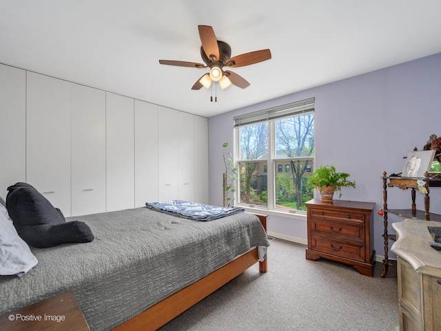 bedroom featuring carpet flooring, baseboards, and a ceiling fan