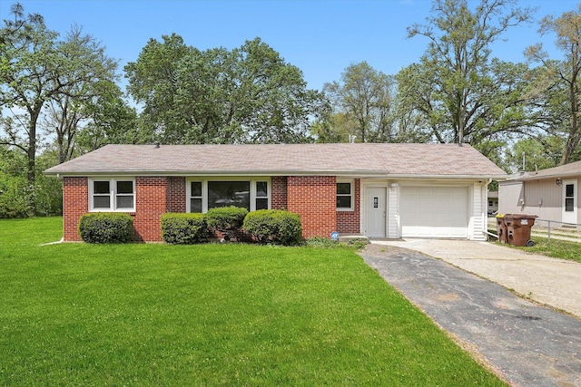 28 Liberty Blvd, Machesney Park, IL 61115 - ranch-style house featuring a garage, driveway, a front yard, and brick siding