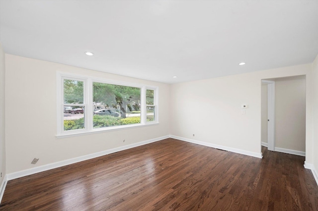 28 Liberty Blvd, Machesney Park, IL 61115 - unfurnished room featuring dark wood-type flooring, baseboards, and recessed lighting