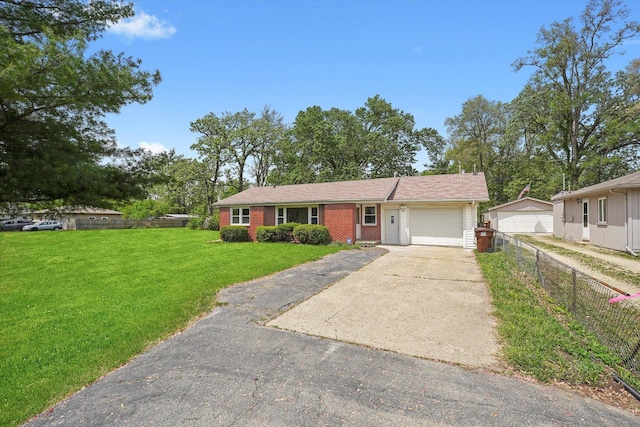 28 Liberty Blvd, Machesney Park, IL 61115 - ranch-style home with asphalt driveway, an attached garage, and brick siding