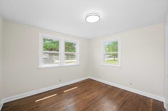 28 Liberty Blvd, Machesney Park, IL 61115 - unfurnished room featuring baseboards and dark wood-type flooring