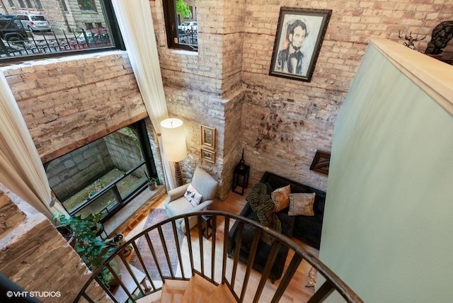 540 W Belden Ave Unit 1A, Chicago, IL 60614 - staircase with wood finished floors and brick wall