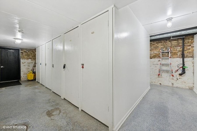 540 W Belden Ave Unit 1A, Chicago, IL 60614 - hall featuring brick wall and baseboards