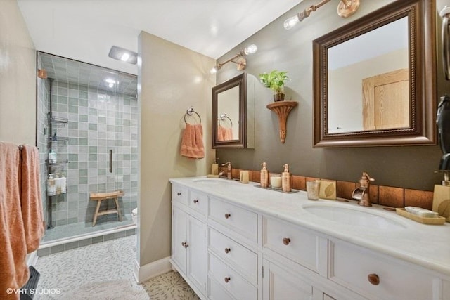 540 W Belden Ave Unit 1A, Chicago, IL 60614 - bathroom featuring double vanity, a tile shower, and toilet