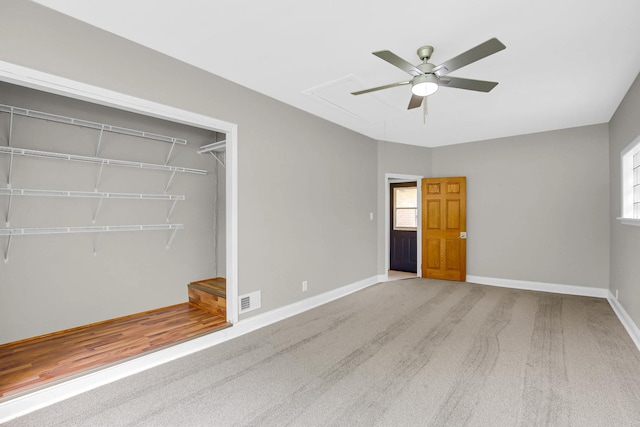 805 Grand Blvd, Joliet, IL 60436 - unfurnished bedroom with baseboards, a closet, ceiling fan, and carpet flooring