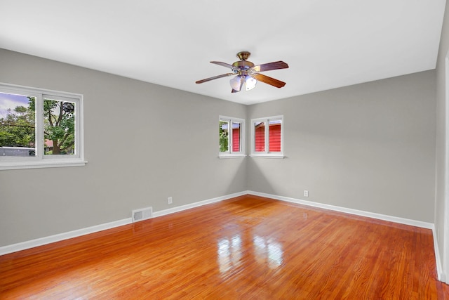 805 Grand Blvd, Joliet, IL 60436 - empty room with ceiling fan, baseboards, and light wood finished floors