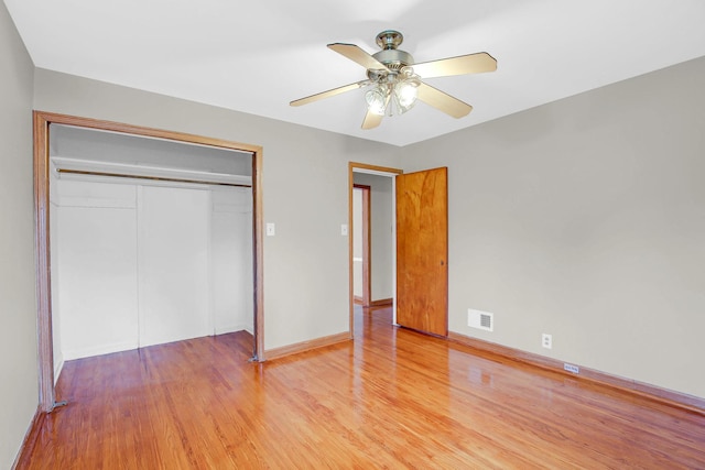 805 Grand Blvd, Joliet, IL 60436 - unfurnished bedroom featuring light wood-type flooring, a closet, and baseboards