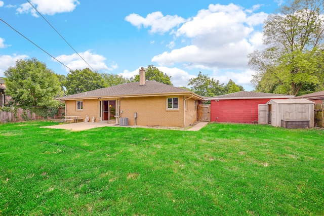 805 Grand Blvd, Joliet, IL 60436 - rear view of property with a patio, a chimney, central AC, and brick siding