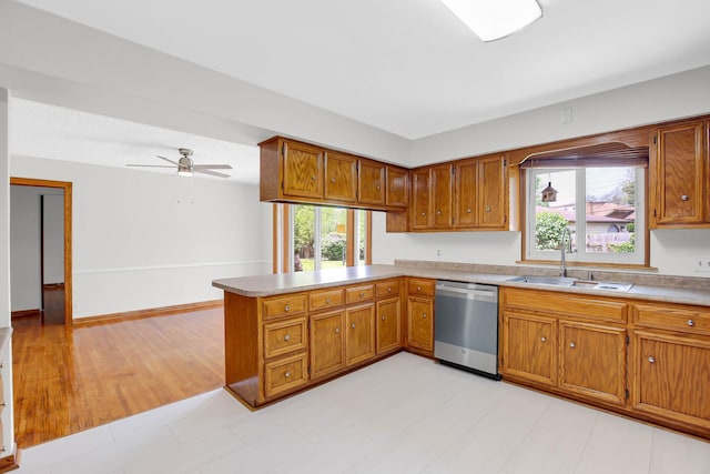 805 Grand Blvd, Joliet, IL 60436 - kitchen featuring stainless steel dishwasher, a sink, a peninsula, and plenty of natural light