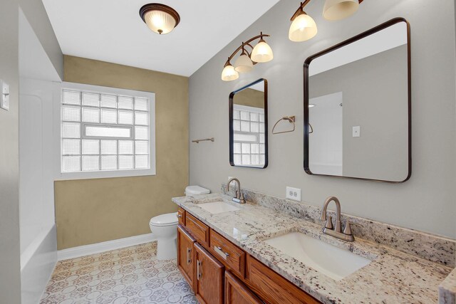 805 Grand Blvd, Joliet, IL 60436 - full bathroom featuring baseboards, toilet, and double vanity