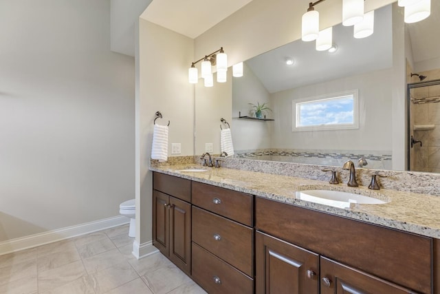 22709 Stanford Dr, Frankfort, IL 60423 - bathroom featuring double vanity, toilet, baseboards, tiled shower, and lofted ceiling