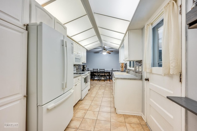 566 Ridge Ave, Elk Grove Village, IL 60007 - kitchen with white appliances, light tile patterned floors, white cabinets, ceiling fan, and a sink
