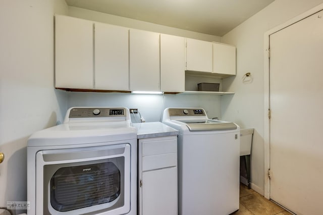 566 Ridge Ave, Elk Grove Village, IL 60007 - laundry area featuring cabinet space, washer and clothes dryer, and light tile patterned floors