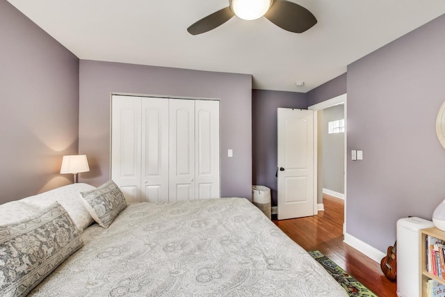 1524 Cleveland St, Evanston, IL 60202 - bedroom with baseboards, a closet, wood finished floors, and ceiling fan