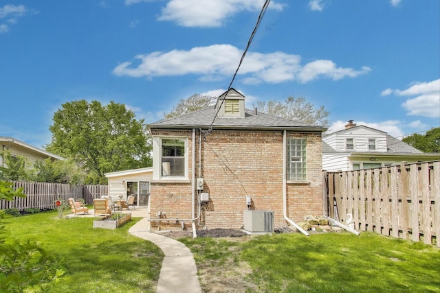 1524 Cleveland St, Evanston, IL 60202 - rear view of property with brick siding, central air condition unit, a patio, and roof with shingles