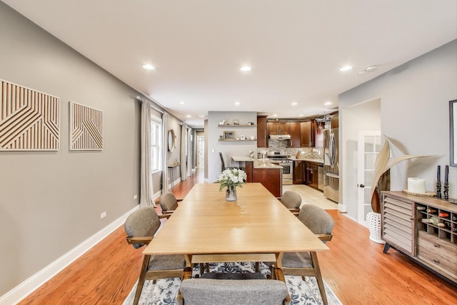 1524 Cleveland St, Evanston, IL 60202 - dining area with light wood-style floors, recessed lighting, and baseboards
