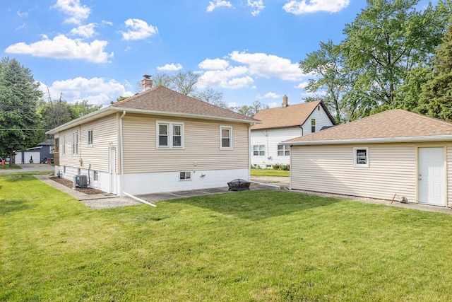 610 Clinton St, Lockport, IL 60441 - back of house featuring a yard, central AC, and a shingled roof