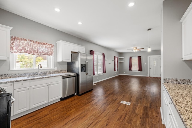 610 Clinton St, Lockport, IL 60441 - kitchen featuring stainless steel appliances, a sink, open floor plan, ceiling fan, and dark wood-style floors