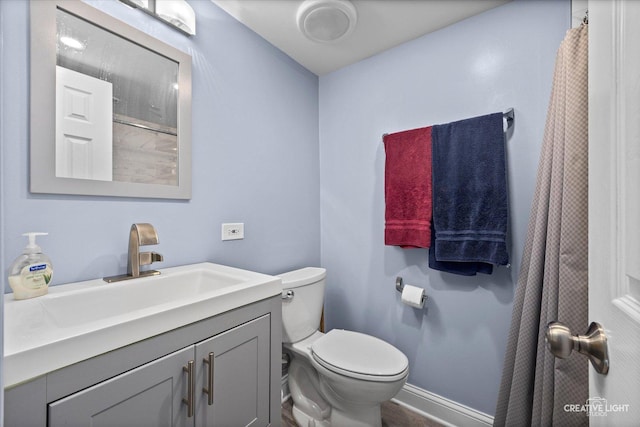 6406 Marshall Dr, Woodridge, IL 60517 - bathroom with toilet, vanity, baseboards, and curtained shower
