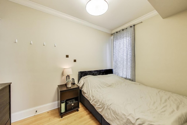 2336 W Roscoe St Unit 3R, Chicago, IL 60618 - bedroom featuring ornamental molding, wood finished floors, and baseboards