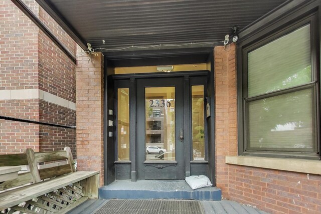 2336 W Roscoe St Unit 3R, Chicago, IL 60618 - property entrance featuring brick siding